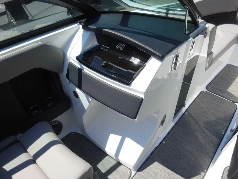Slide: The Image of Interior of 2024 Four Winns H6 boat, featuring sleek seating and modern dashboard design. - 20