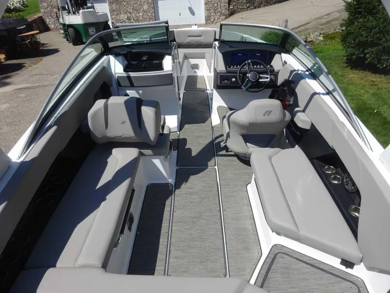Slide: The Image of 2024 Four Winns H6 boat interior with spacious seating and modern dashboard. - 6