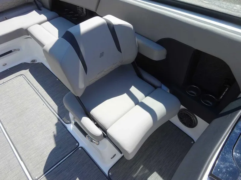 Slide: The Image of 2024 Four Winns H6 boat interior with gray seating and modern design. - 8