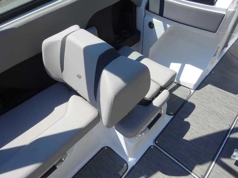 Slide: The Image of 2024 Four Winns H6 boat interior with gray seating and modern design. - 9
