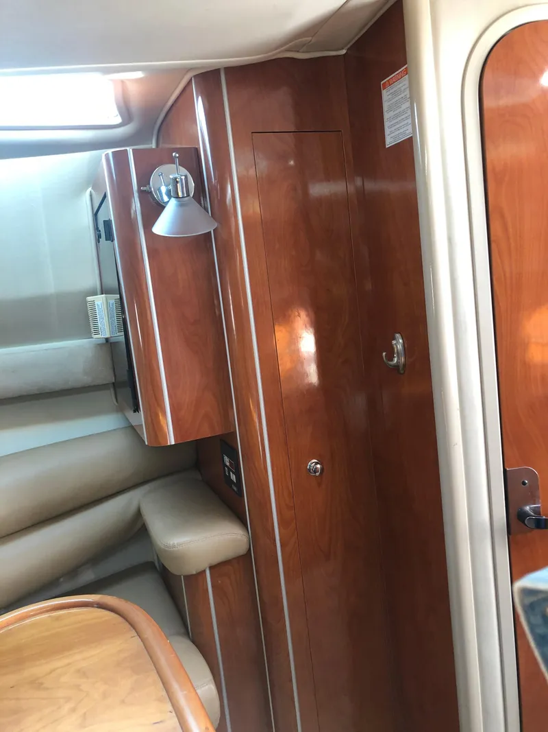 Slide: The Image of 2005 Doral Monticello cabin interior with wood paneling and seating. - 16