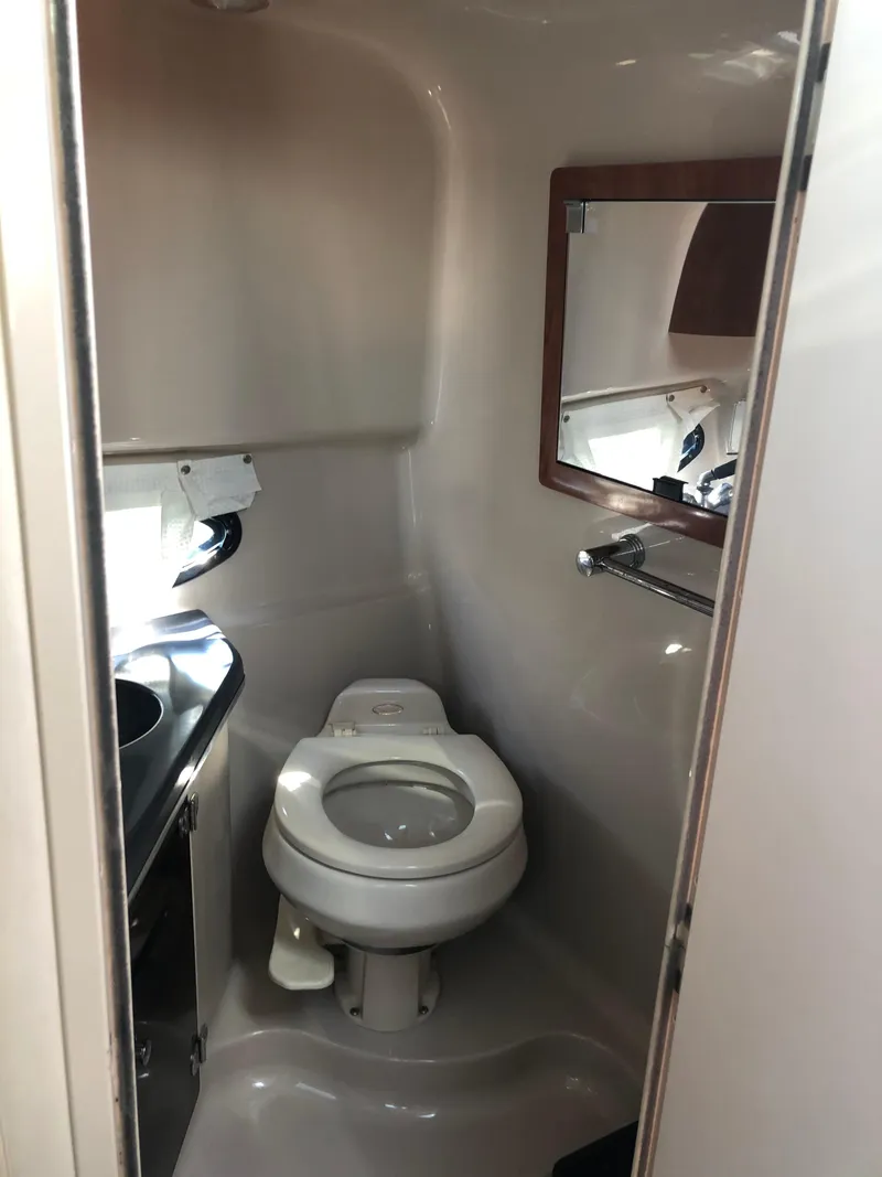 Slide: The Image of 2005 Doral Monticello boat bathroom with toilet, sink, and mirror. - 17