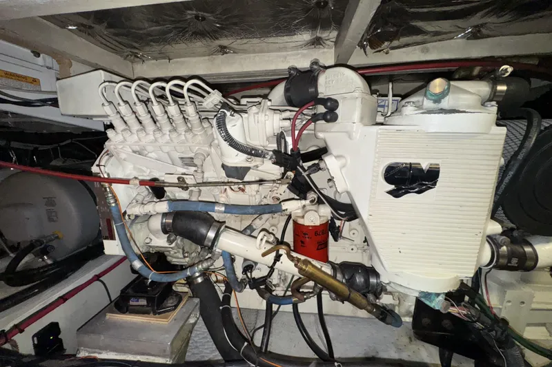 Slide: The Image of Engine room of 1988 Chris-Craft 392 Commander, showcasing detailed mechanical components. - 22