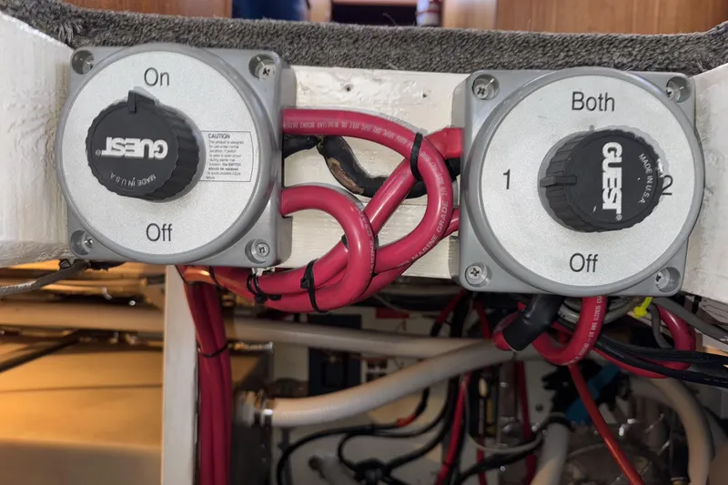 Slide: The Image of Battery switches on a 1988 Chris-Craft 392 Commander boat with red wiring. - 26