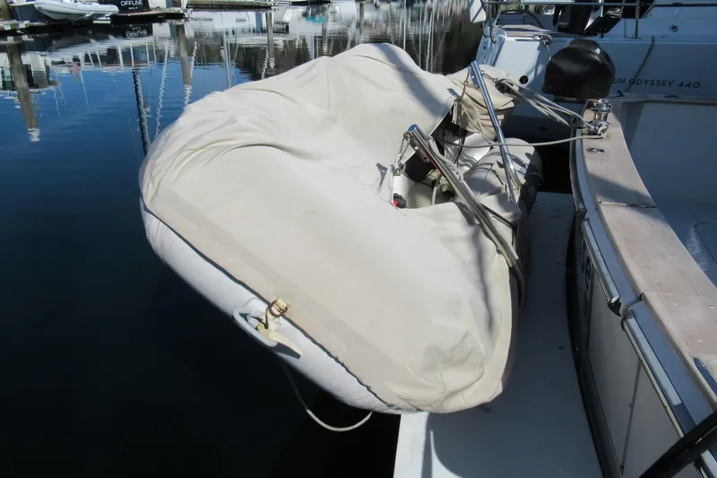Slide: The Image of Covered dinghy on a 1988 Chris-Craft 392 Commander yacht at a marina. - 31
