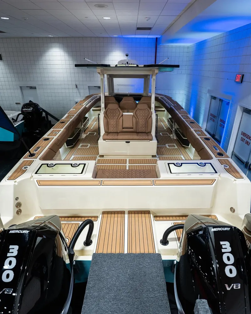 Slide: The Image of 2025 BlueCat 30 boat with twin Mercury 300 V8 engines in showroom. - 3