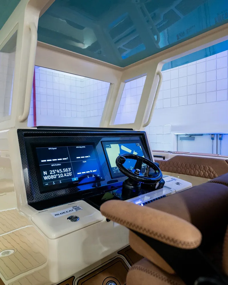 Slide: The Image of Modern BlueCat 30 boat cockpit, 2025 model, featuring advanced navigation system. - 5