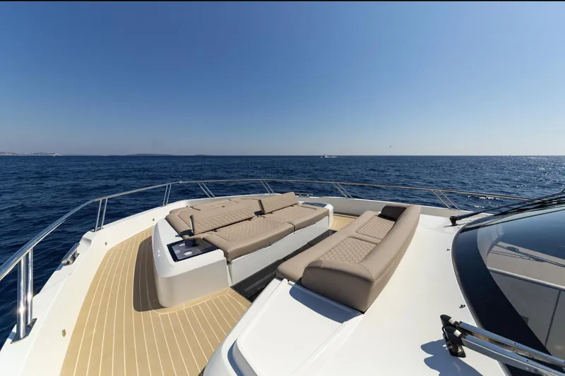 Slide: The Image of Luxury deck of 2024 Galeon 560 Fly yacht with sun loungers and ocean view. - 21