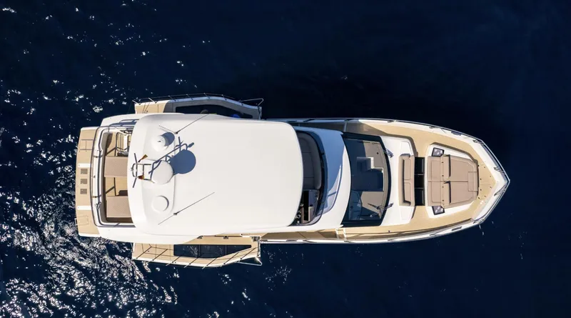 Slide: The Image of Aerial view of 2024 Galeon 560 Fly yacht cruising on open water. - 24