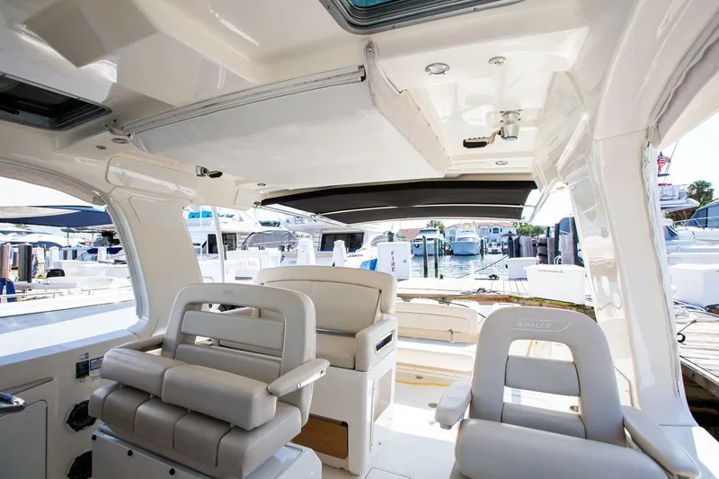 Slide: The Image of Interior of 2019 Boston Whaler 380 Realm boat with luxurious seating and modern design. - 10