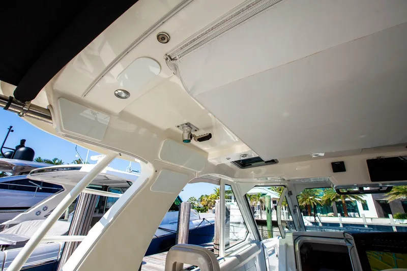 Slide: The Image of Interior view of 2019 Boston Whaler 380 Realm boat, showcasing sleek design and modern features. - 18
