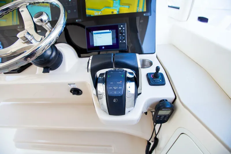 Slide: The Image of 2019 Boston Whaler 380 Realm helm with advanced navigation controls and touchscreen displays. - 24