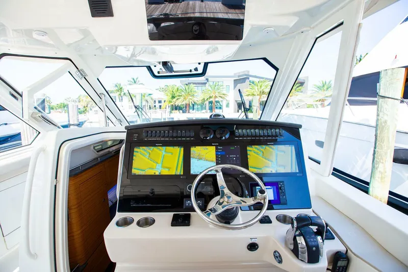 Slide: The Image of 2019 Boston Whaler 380 Realm helm with advanced navigation systems and controls. - 26