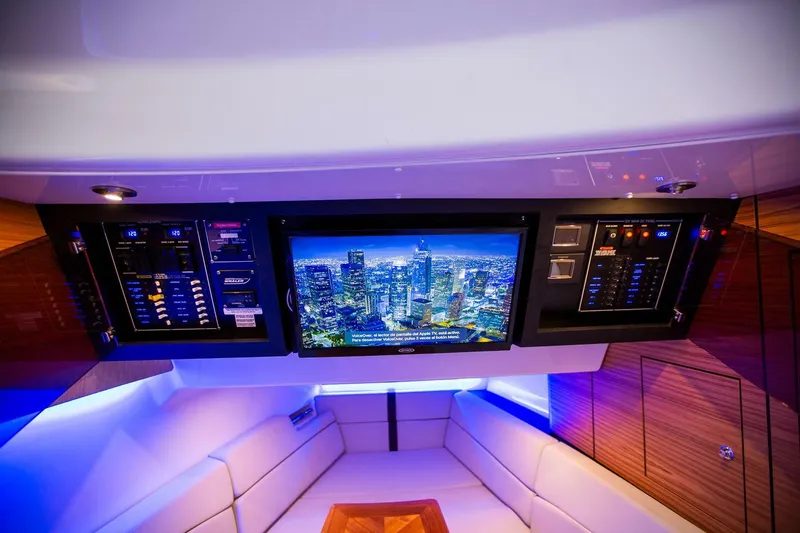 Slide: The Image of Interior of 2019 Boston Whaler 380 Realm with control panels and TV screen. - 32