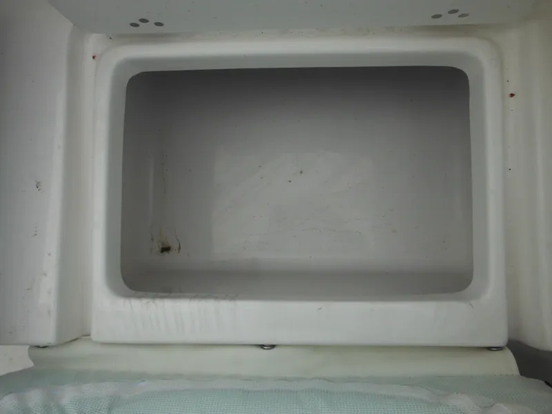 Slide: The Image of 2024 Tidewater 210 LXF boat storage compartment. - 18