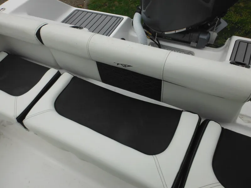 Slide: The Image of 2024 Tidewater 210 LXF boat seating and engine area. - 21