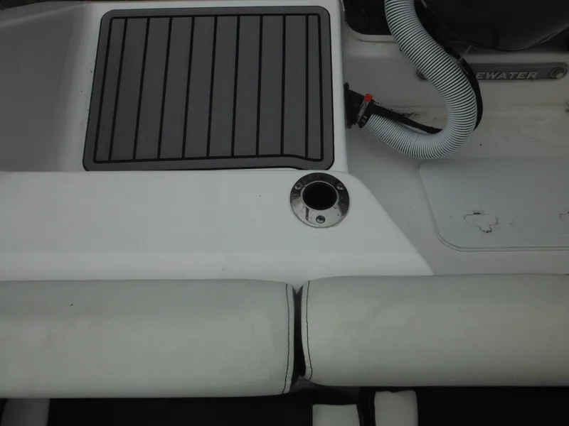 Slide: The Image of 2024 Tidewater 210 LXF boat interior, featuring seating and deck details. - 22