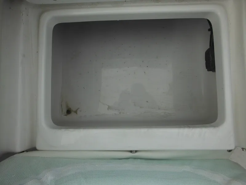 Slide: The Image of 2024 Tidewater 210 LXF boat storage compartment, empty and clean. - 23
