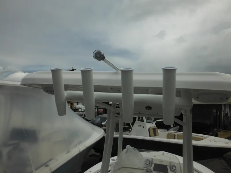 Slide: The Image of 2024 Tidewater 210 LXF boat with rod holders and T-top. - 26