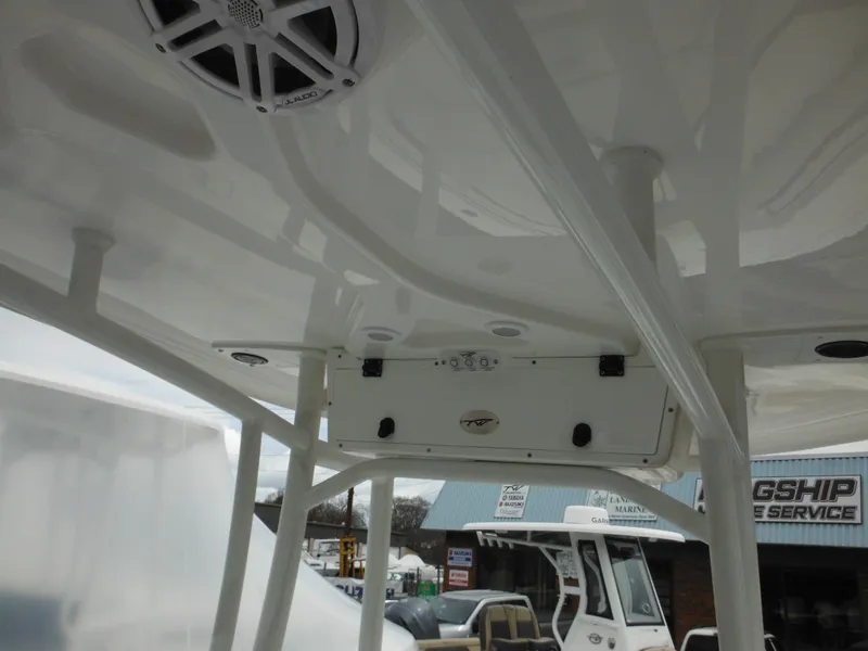 Slide: The Image of 2024 Tidewater 210 LXF boat interior with speakers and control panel. - 27