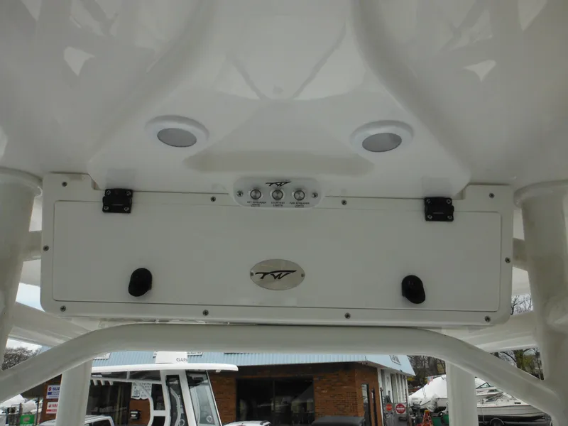 Slide: The Image of 2024 Tidewater 210 LXF boat console with speakers and control panel. - 29