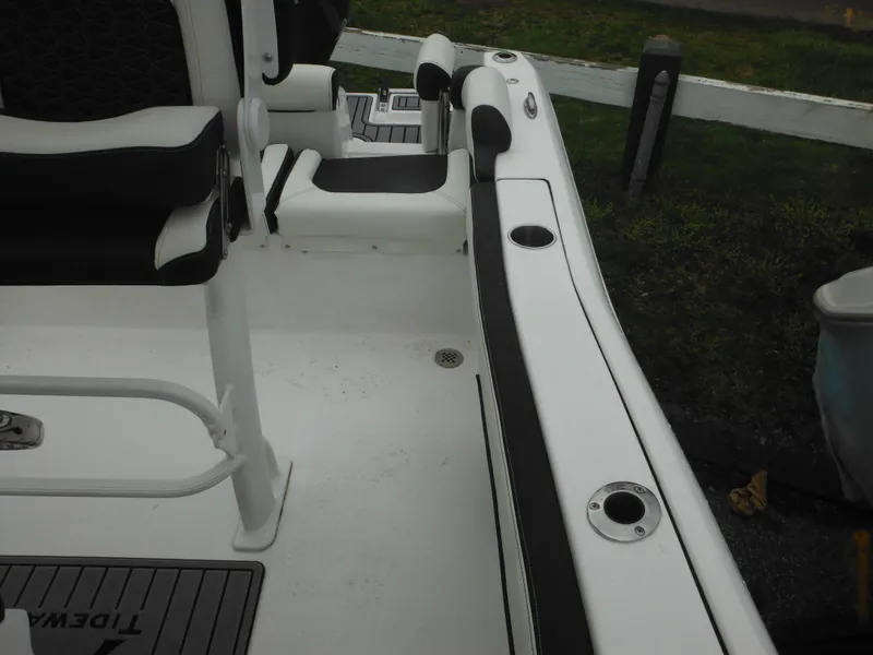 Slide: The Image of 2024 Tidewater 210 LXF boat interior with seating and rod holders. - 30