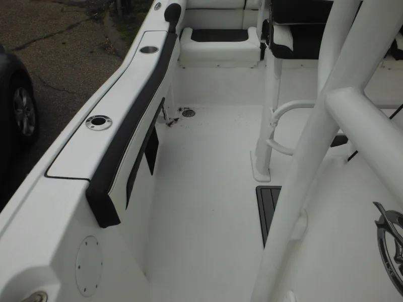 Slide: The Image of 2024 Tidewater 210 LXF boat interior with seating and rod holders. - 31