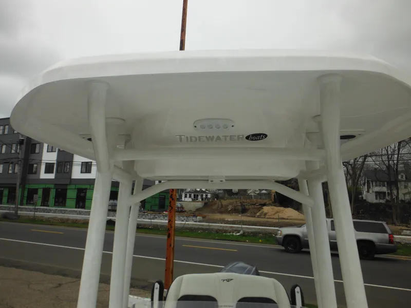 Slide: The Image of 2024 Tidewater 210 LXF boat T-top and console on display. - 32