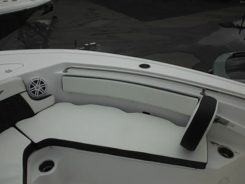 Slide: The Image of 2024 Tidewater 210 LXF boat interior seating with white and black upholstery. - 35