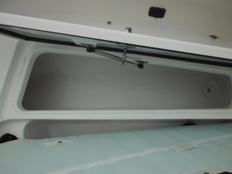 Slide: The Image of 2024 Tidewater 210 LXF storage compartment with open lid. - 36