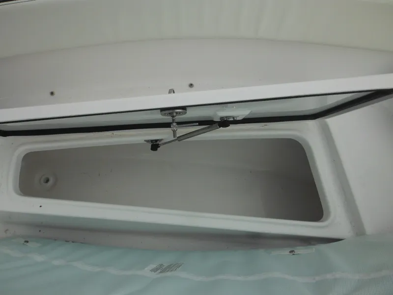 Slide: The Image of Open storage compartment on a 2024 Tidewater 210 LXF boat. - 42