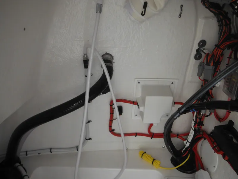 Slide: The Image of Interior wiring and components of a 2024 Tidewater 210 LXF boat. - 47