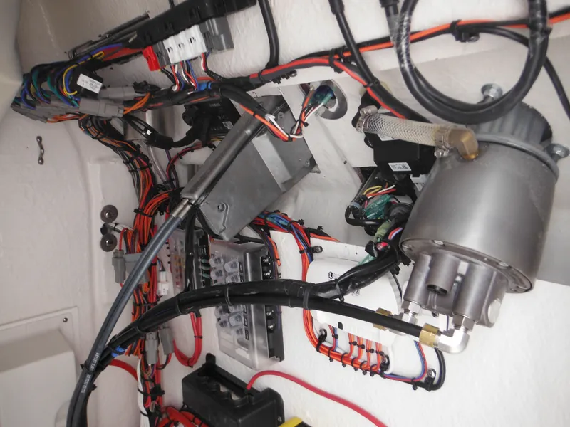 Slide: The Image of Electrical wiring and components inside a 2024 Tidewater 210 LXF boat. - 48