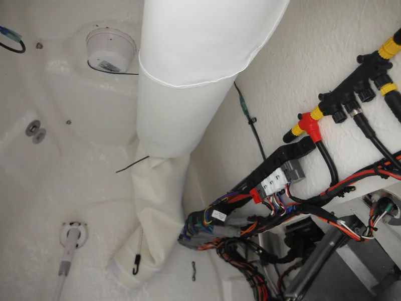 Slide: The Image of 2024 Tidewater 210 LXF boat interior wiring and components. - 49