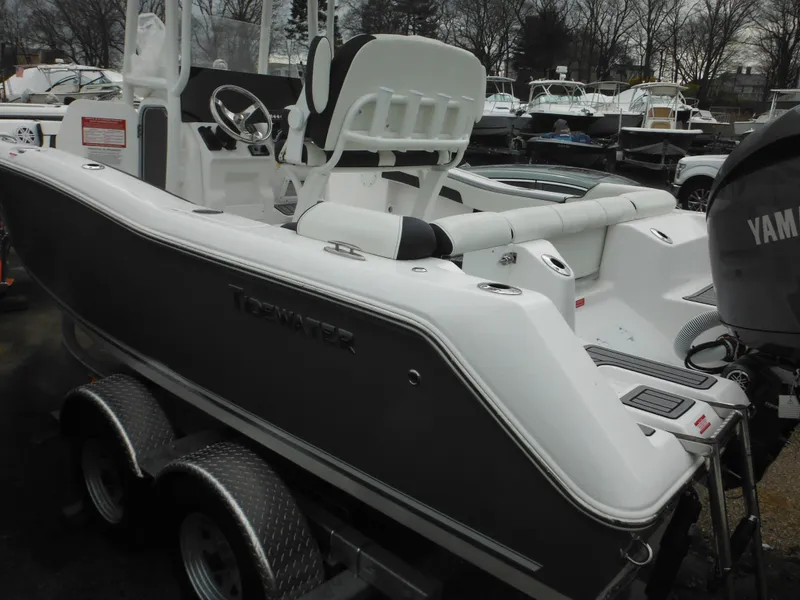 Slide: The Image of 2024 Tidewater 210 LXF boat on trailer, rear view with Yamaha outboard motor. - 5