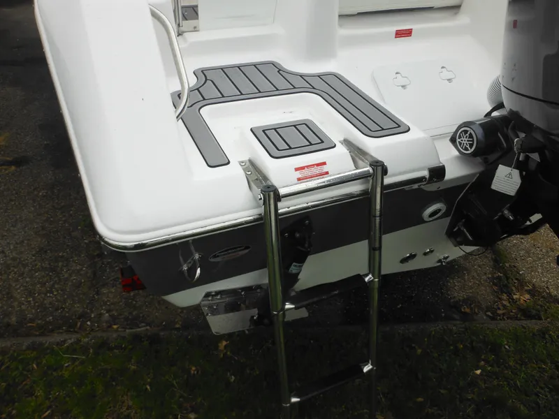 Slide: The Image of 2024 Tidewater 210 LXF boat stern with swim ladder and outboard motor. - 6