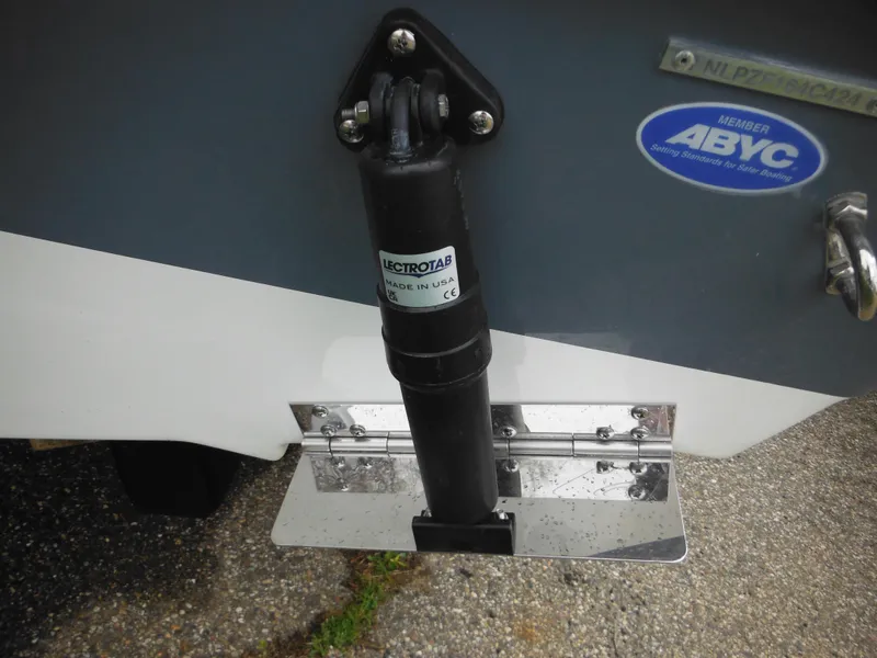 Slide: The Image of Close-up of 2024 Tidewater 210 LXF boat trim tab and actuator. - 7