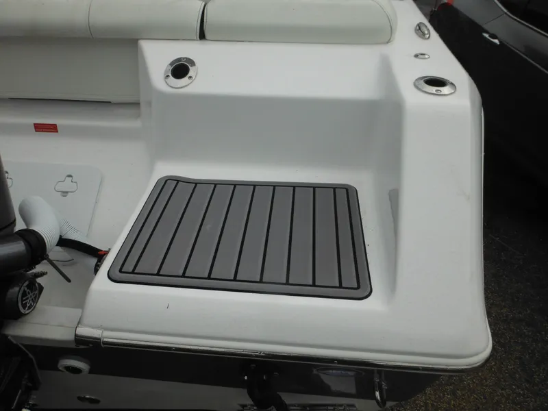 Slide: The Image of 2024 Tidewater 210 LXF boat stern with seating and non-slip deck. - 8