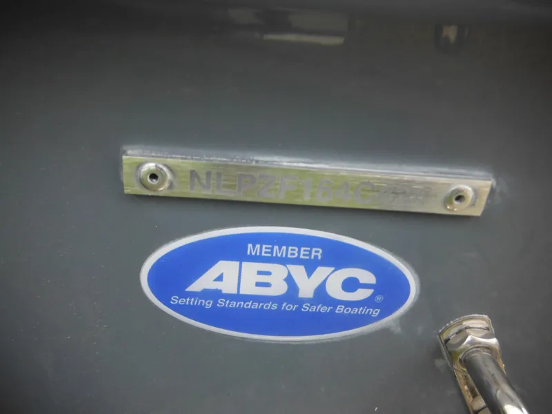 Slide: The Image of 2024 Tidewater 210 LXF boat with ABYC member sticker and serial number plate. - 9