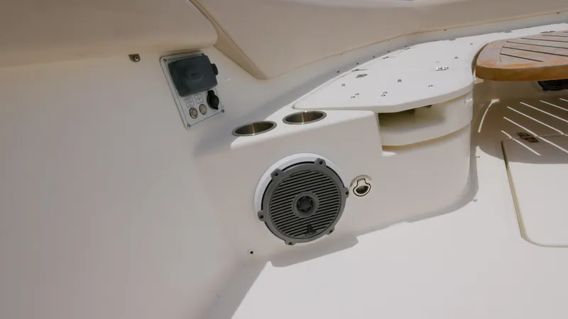 Slide: The Image of 2016 Boston Whaler 420 Outrage boat interior with speaker and cup holders. - 19