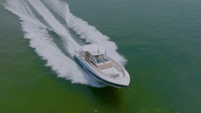 Slide: The Image of 2016 Boston Whaler 420 Outrage cruising on open water. - 2
