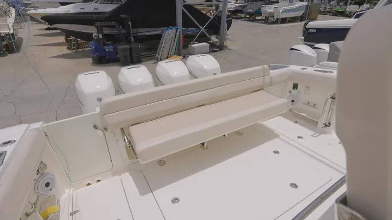 Slide: The Image of 2016 Boston Whaler 420 Outrage boat with rear seating and multiple outboard engines. - 6