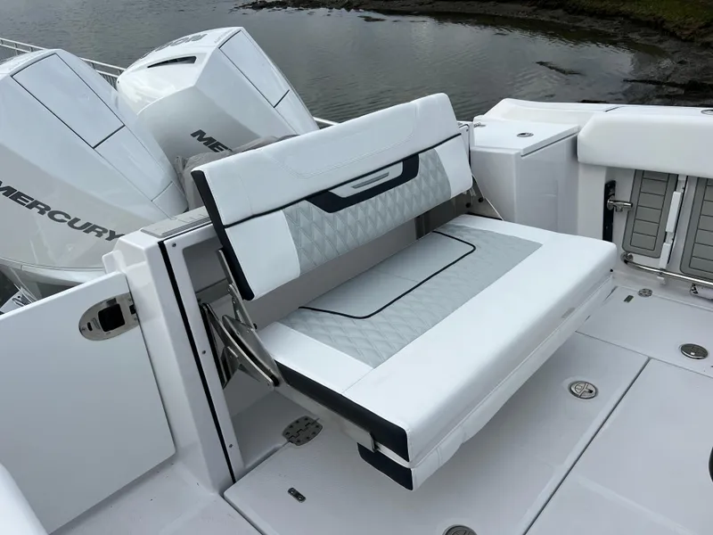 Slide: The Image of 2024 Blackfin 252 CC boat with foldable seating and twin Mercury outboard engines. - 13