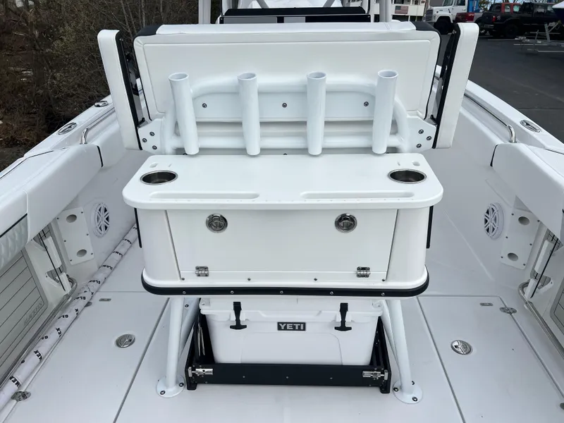 Slide: The Image of 2024 Blackfin 252 CC center console with rod holders and Yeti cooler. - 14