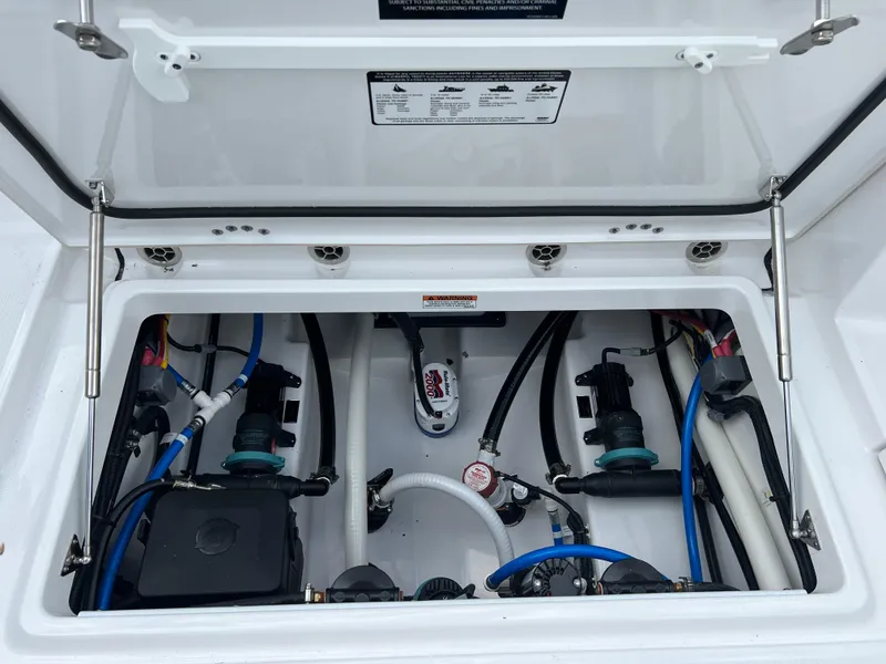 Slide: The Image of 2024 Blackfin 252 CC boat engine compartment with wiring and components. - 17