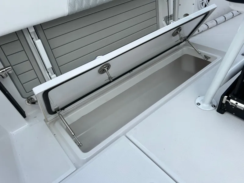 Slide: The Image of Open storage compartment on 2024 Blackfin 252 CC boat. - 19
