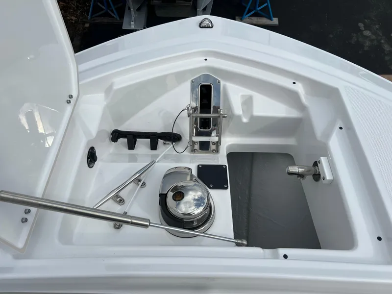 Slide: The Image of 2024 Blackfin 252 CC anchor locker with windlass and storage compartments. - 7