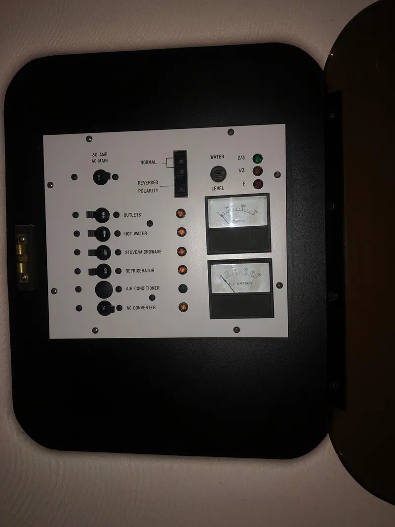 Slide: The Image of Electrical control panel on a 1989 Sea Ray 280 Sundancer boat. - 20