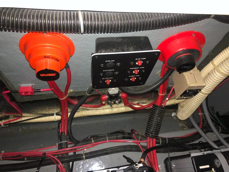 Slide: The Image of Electrical panel and wiring inside a 1989 Sea Ray 280 Sundancer boat. - 25