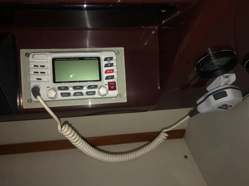 Slide: The Image of VHF radio system on 1989 Sea Ray 280 Sundancer boat dashboard. - 27